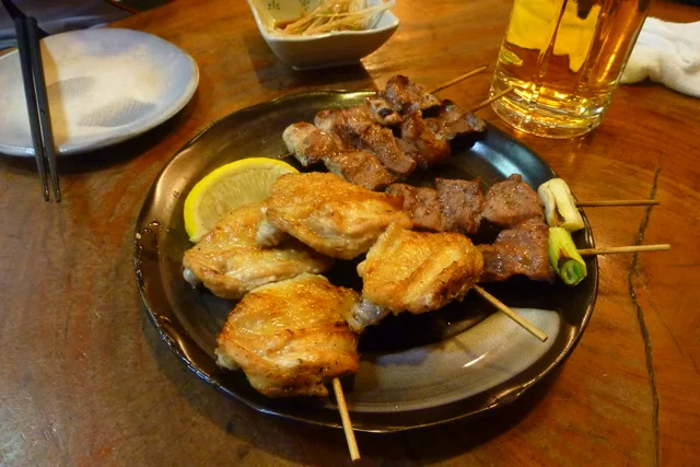 Grilled yakitori skewers arranged on a plate