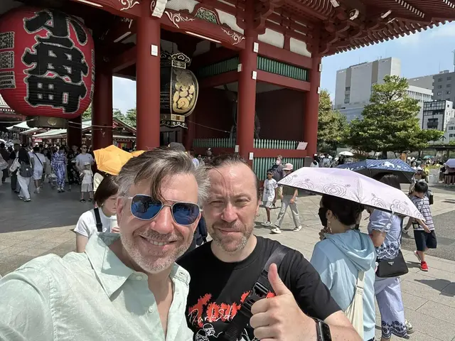 Renaud and a guest beside the red lantern at Senso-ji