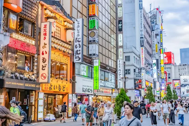 Colourful restaurant signs and pedestrians in Shinjuku