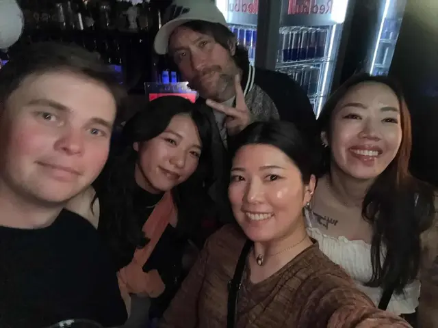 A shared night out — good company around the bar.