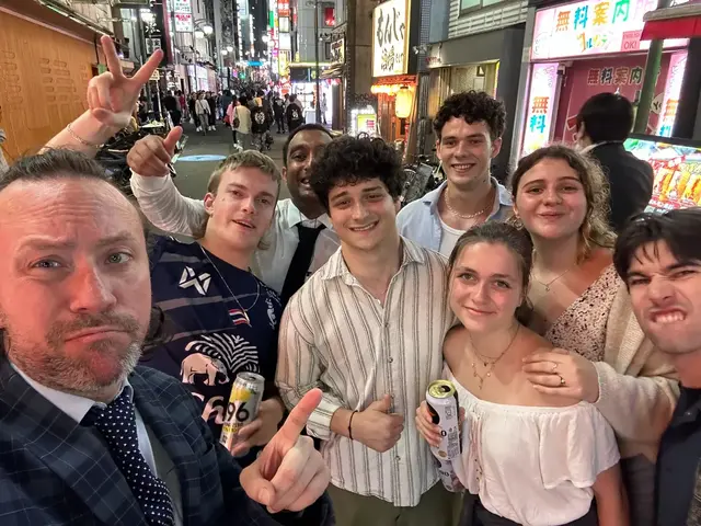 Together in the neon streets — the group’s night begins here.