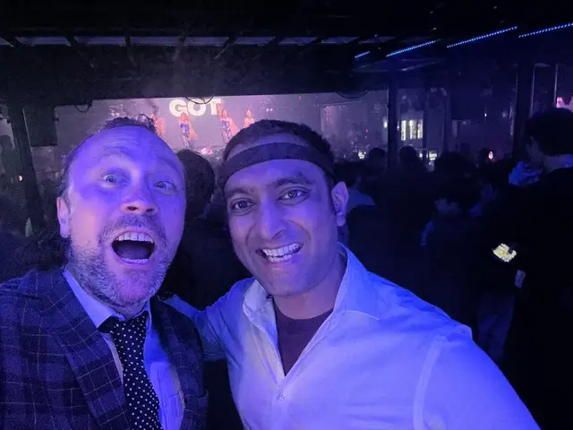 Under the club lights — enjoying the music together.