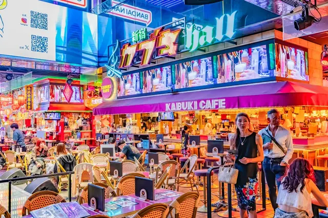 Kabukicho — colourful signs and a lively indoor dining scene.