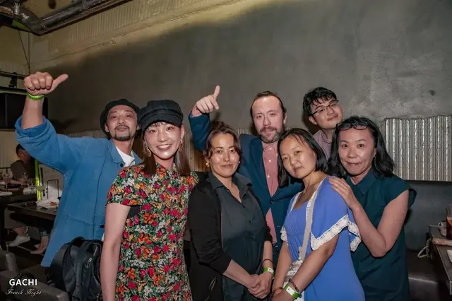 A night shared with new friends — smiles and good company in the lounge.